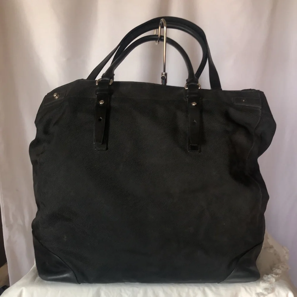 TUMI large black weekender bag. Leather and nylon. Detachable strap.